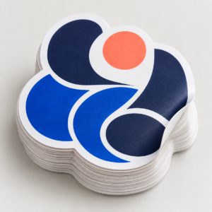 Stack of premium custom die-cut vinyl stickers